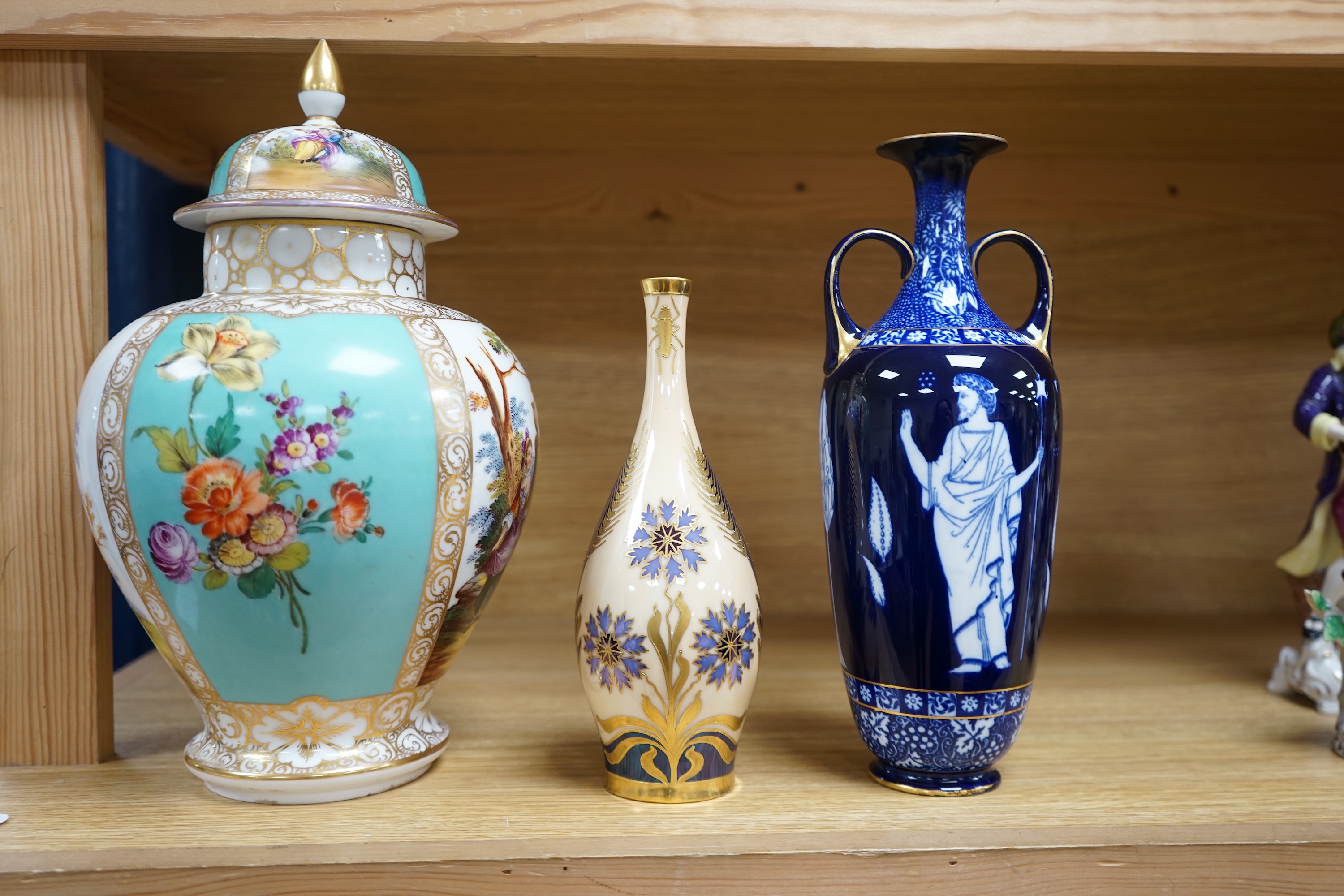 A Dresden porcelain jar and cover, 32cm high, a Doulton Burslem Grecian revival vase and and a Continental Art Nouveau bottle vase (3) condition - Dresden and Doulton restored necks otherwise visible condition